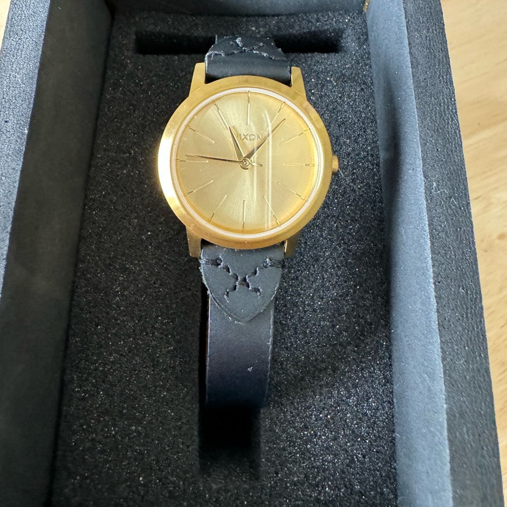 Gold Nixon watch with leather band